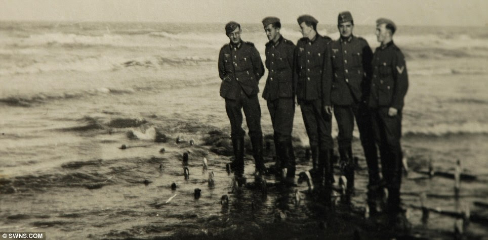 Comrades: Soldiers pictured standing on the beach at Westende, Wokingham 