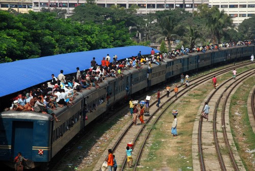 People gather at various train stations in Dhaka to leave the city to celebrate Eid with their friends and families. Image by Saad Shahriar, copyright Demotix (15/11/2010).