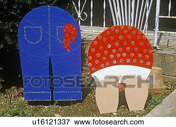 Picture - cutout lawn ornaments 
of rear ends of 
couple gardening. 
fotosearch - search 
stock photos, 
pictures, wall 
murals, images, 
and photo clipart