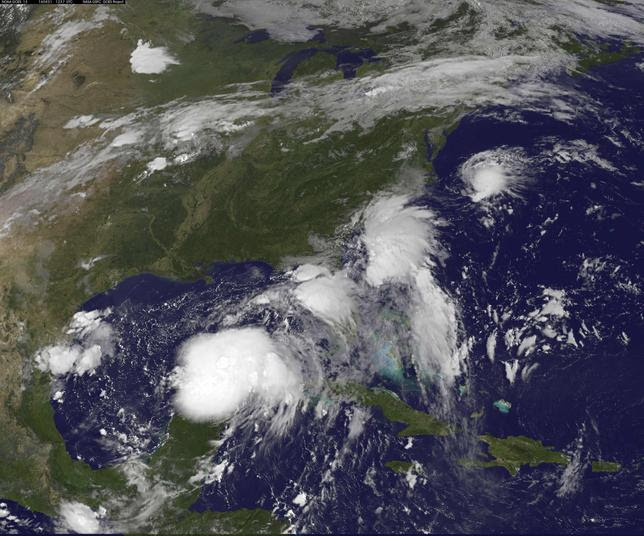 Two Tropical Depressions are shown over the Gulf of Mexico and along the Carolina coast of the United States in this GOES East satellite image captured August 31, 2016. NOAA/Handout via REUTERS