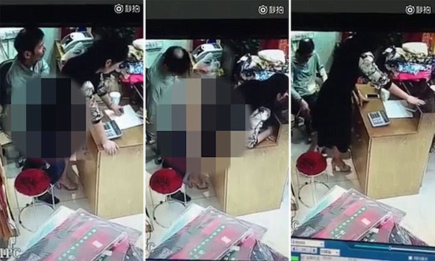 Chinese clothing store owner and employee caught on video having ...