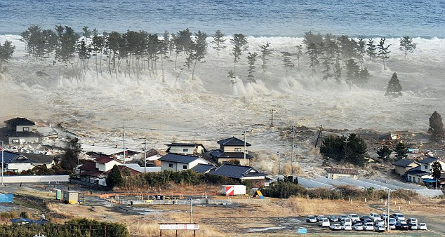 Overwhelmed: The tsunami engulfs a residential area in Natori, Miyagi