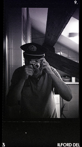 reflected self-portrait with Bencini Koroll II camera and pilot's hat by pho-Tony