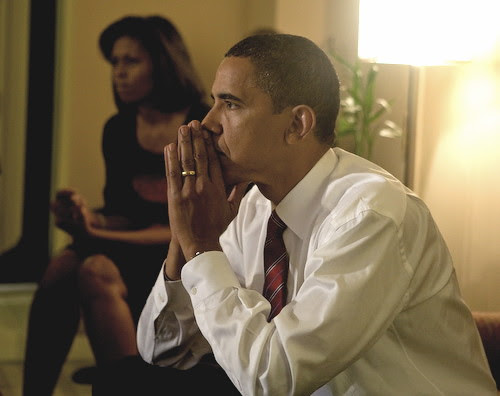 Barack Obama and Michelle Obama watching election returns