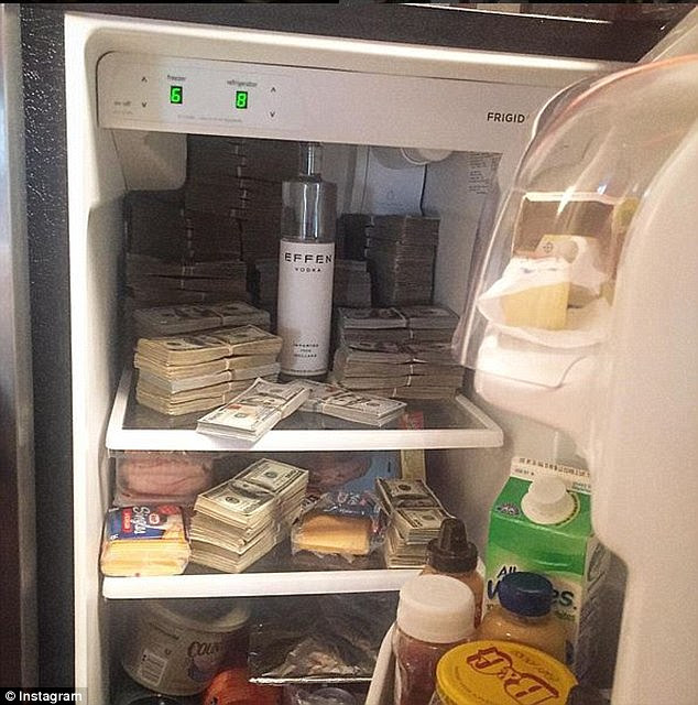 Cold, hard cash: Another pic showed a fridge stuffed with 'money.' The images were flagged by Lastonia Leviston, who won $7million in the sex-tape dispute but cannot collect because 50 Cent says he is broke
