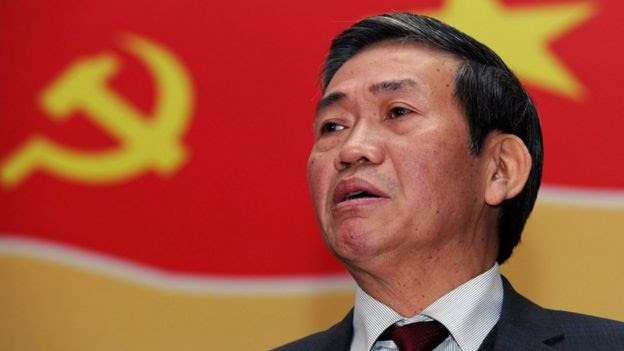 Dinh The Huynh, Central committee member of the ruling Vietnam communist party, answers a question during a press conference in Hanoi on January 10, 2011