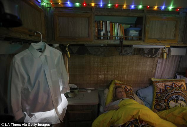 Kathy, 65, and Phil, 74, have been living together in their old RV after losing their condo in 2013. Kathy said she hung up Christmas lights inside the RV for the holiday season