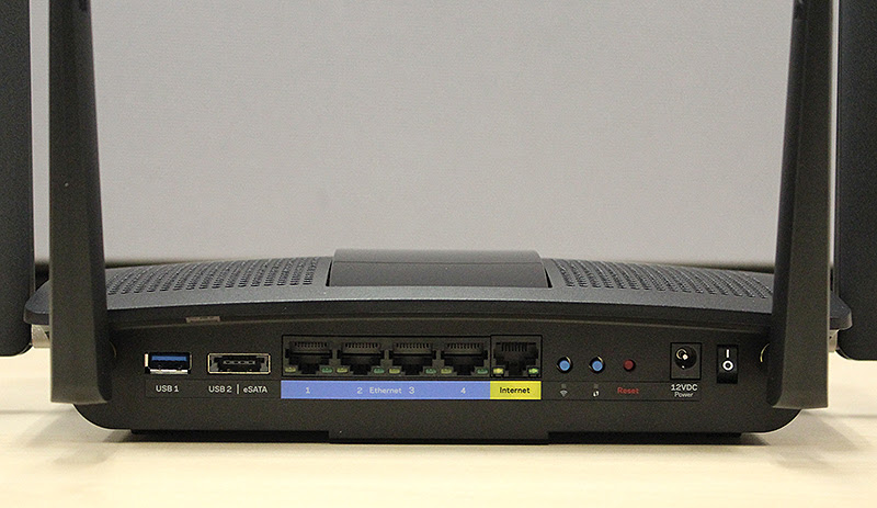 From left to right: the USB 3.0 port, USB 2.0/eSATA combo port, four Gigabit Ethernet LAN ports, a single Gigabit Ethernet WAN port, Wi-Fi on/off button, WPS button, and finally the reset button.