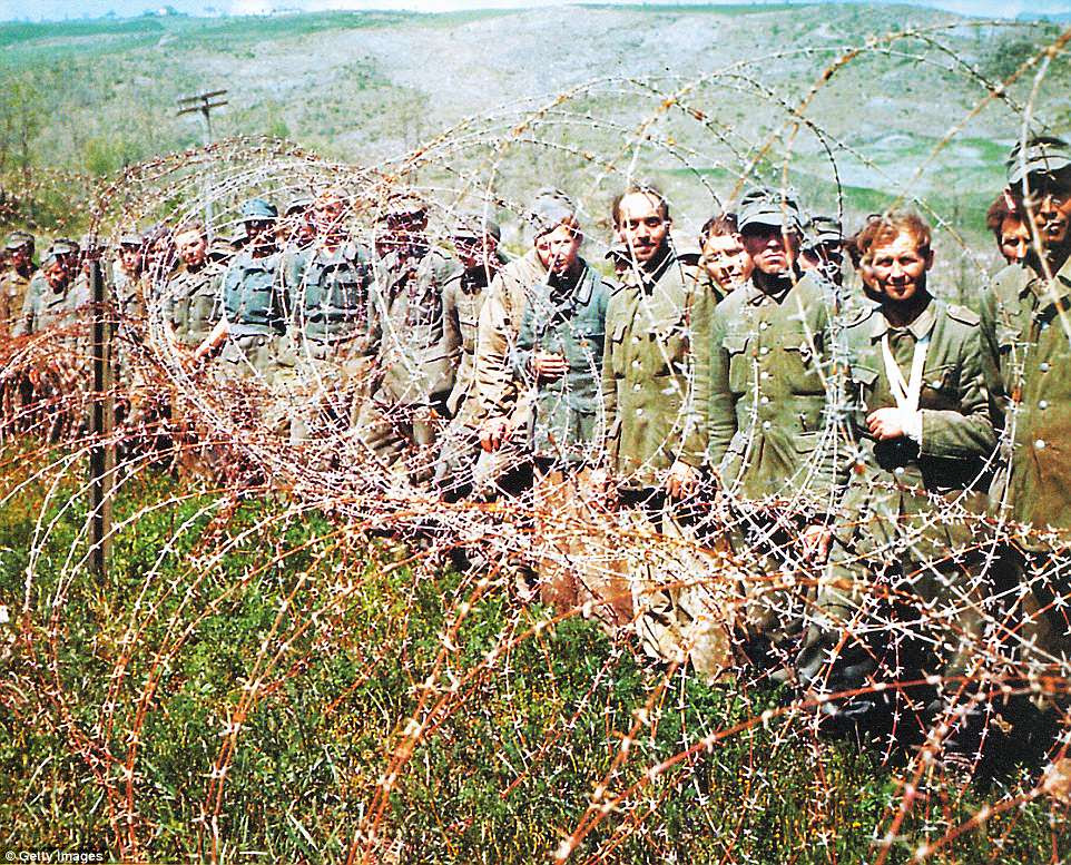 German Prisoners of War have been put behind barbed wire in Normandy in June 1944. More than 200,000 German soldiers were captured during the Battle of Normandy