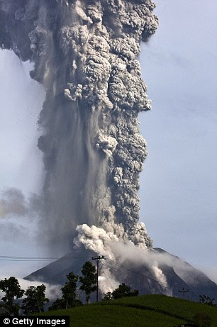 Mount Sinabung spews pyroclastic smoke as seen from Tigapancur village in Karo district