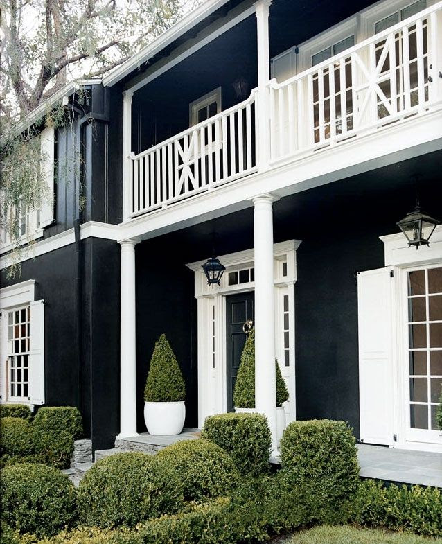 stunning, love the black with all white trim, fabulous bannister and the transom over the door, the shutters and the molding above windows.