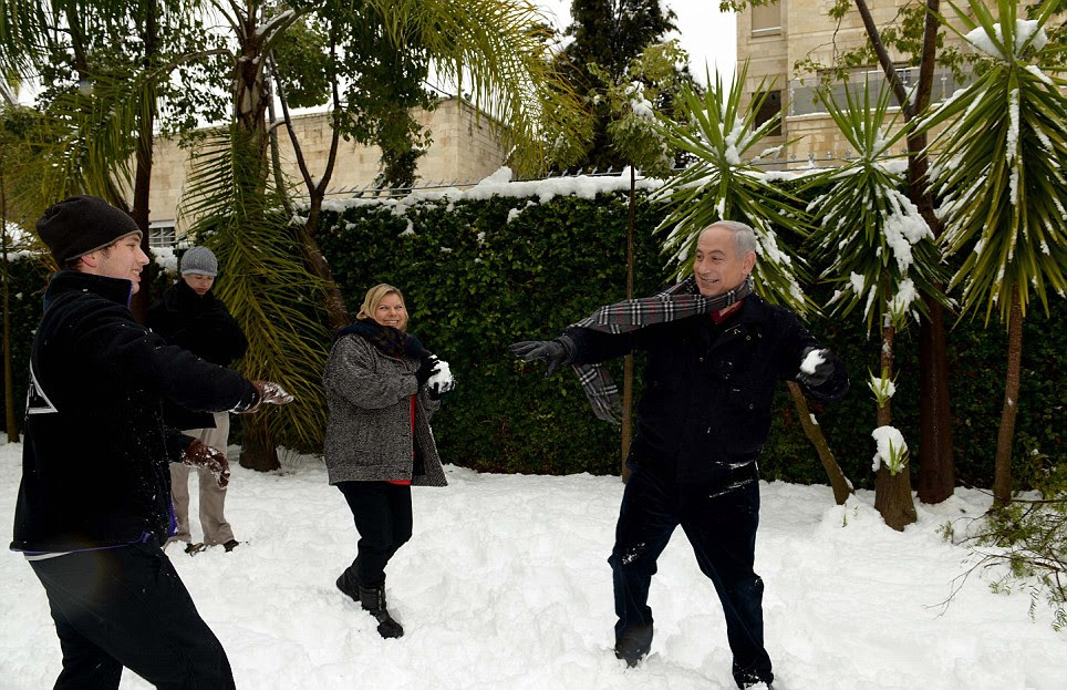 Israeli Prime Minister Benjamin Netanyahu enjoys the snow with his family today as snow as affected several parts of the Middle East