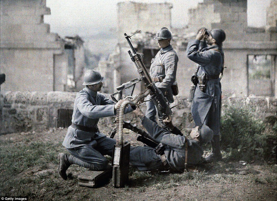 A French section of machine gunners takes position in the ruins during the battle of the Aisne, on the Western Front in 1917