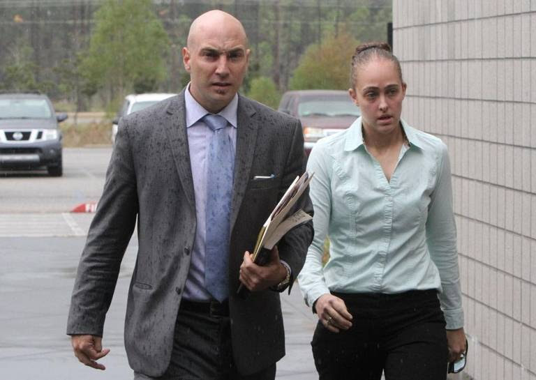 Cassie Barker and her attorney, George Blair, walk to Hancock County Justice Court on Tuesday, Nov. 8, 2016, for her preliminary hearing in the hot-car death of her three-year-old daughter. Barker, a former Long Beach police officer, is charged with manslaughter in the Sept. 30 death of Cheyenne Hyer.