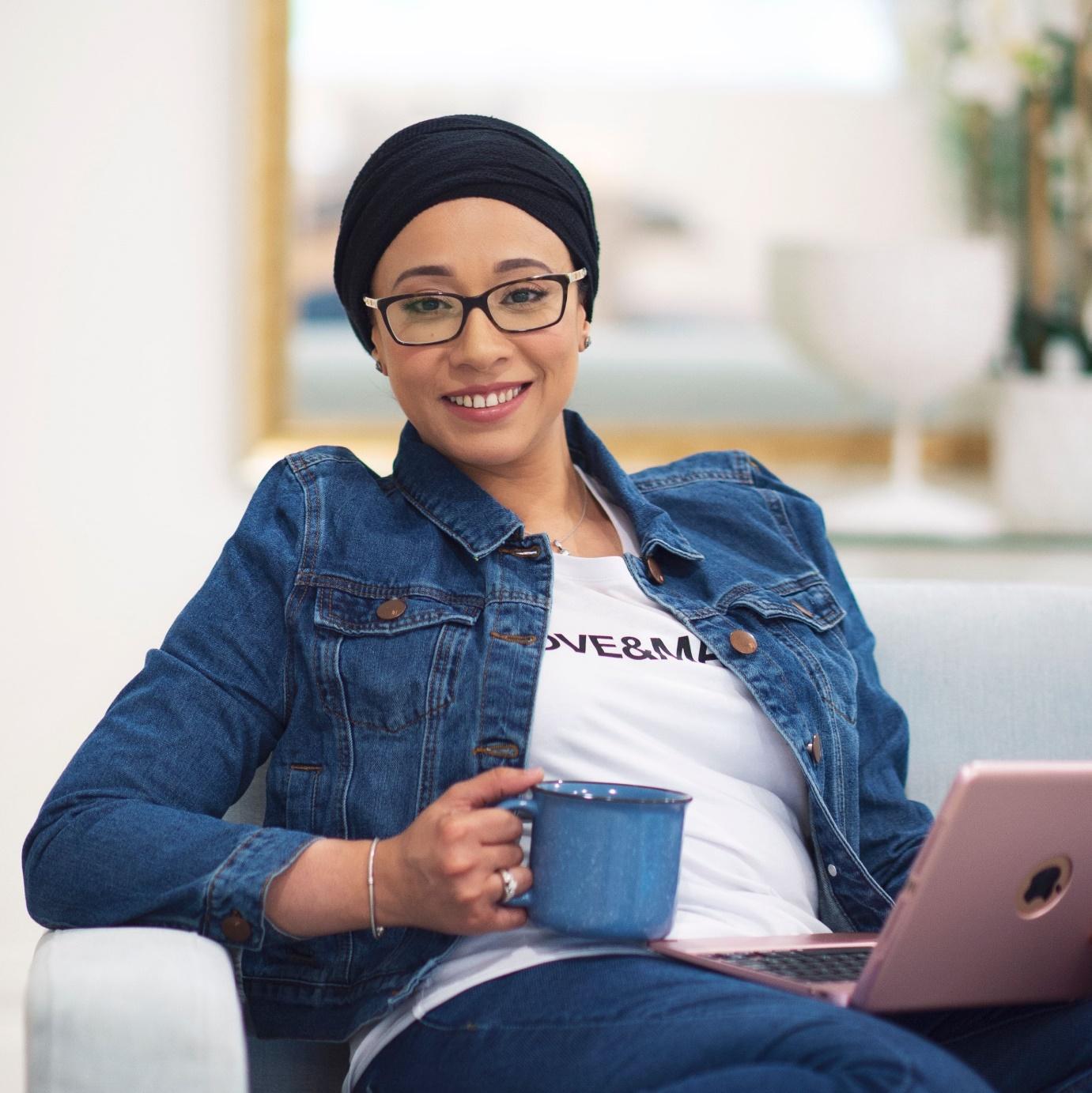 A picture containing person, sitting, computer, personDescription automatically generated
