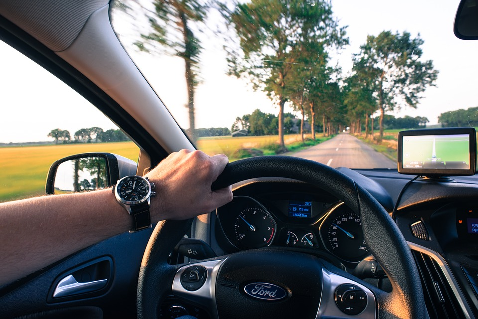 hands holding steering wheel of driving car, responsible driving, transportation, maintenance