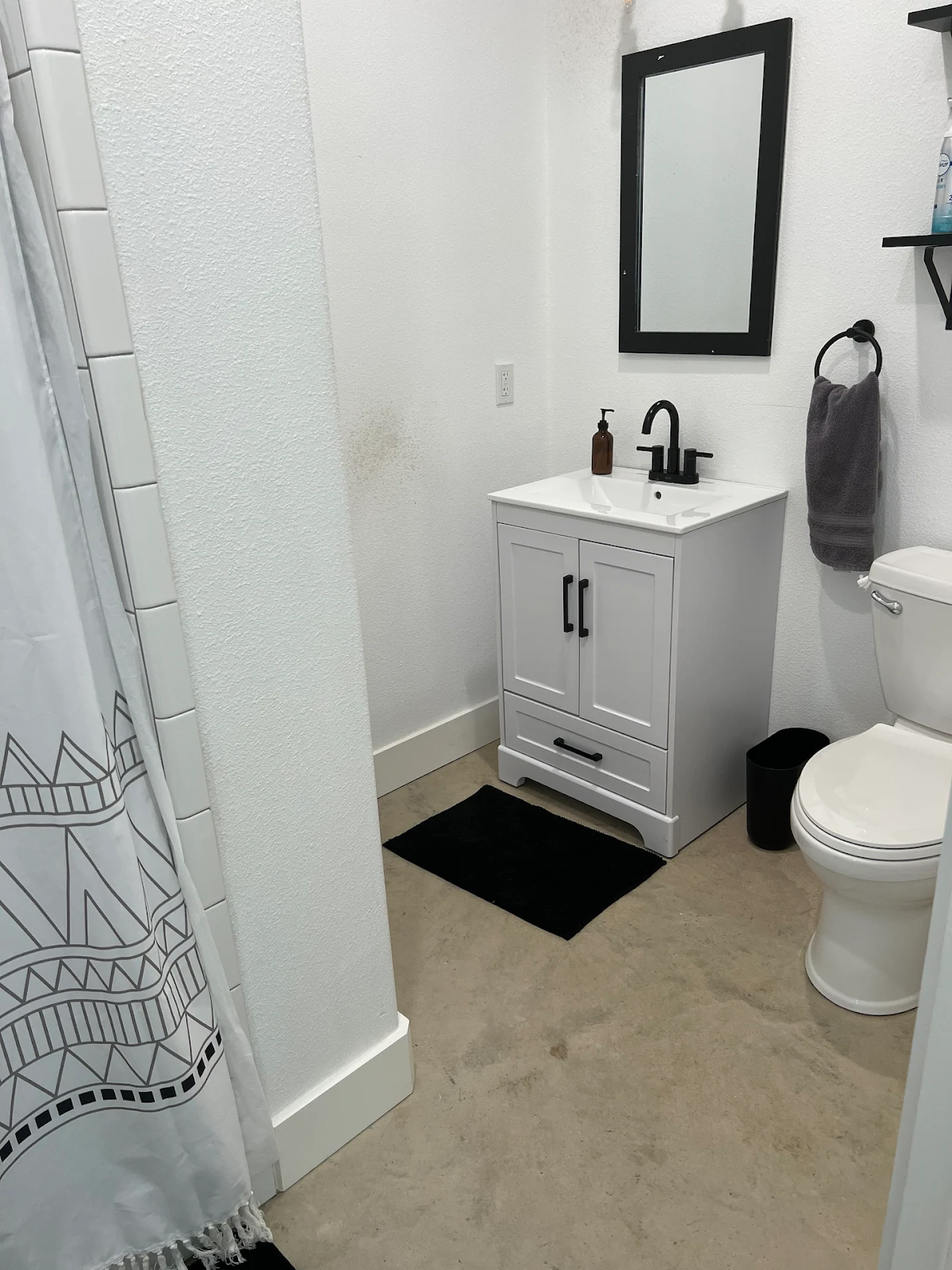 bathroom with black and white theme