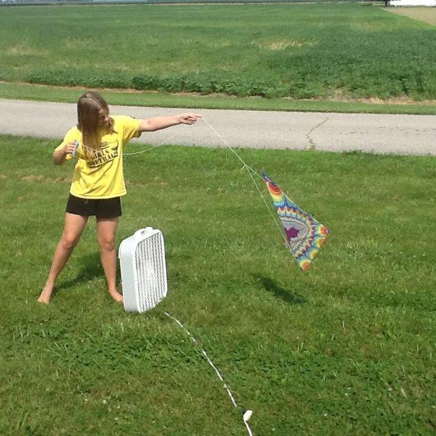 A child flying a kite

Description automatically generated with medium confidence