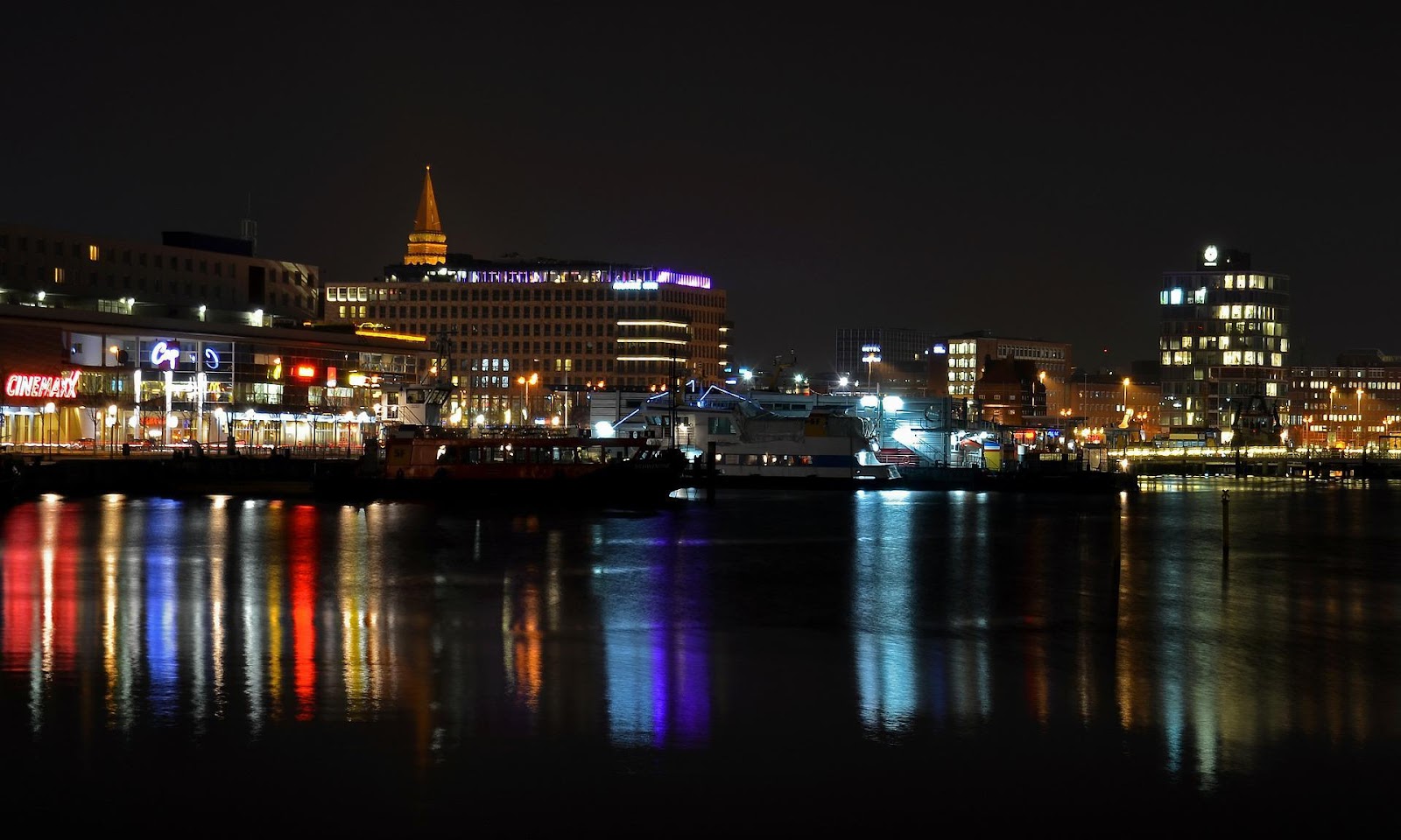 A picture containing water, river, night, city
Description automatically generated