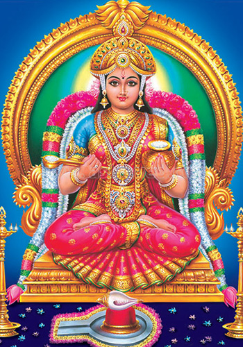 In her pink sari and golden jewelry, Annapurna sits cross-legged on her throne holding a bowl and a spoon. 