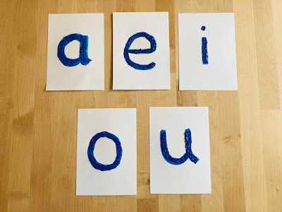 blue Montessori style vowel cars