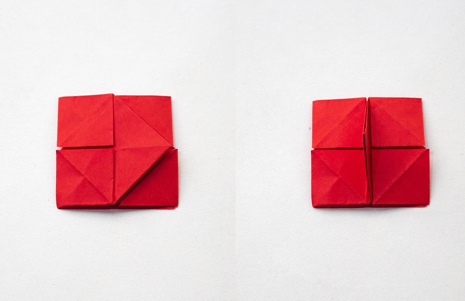 A red sheet of paper with many folds shows two inner triangles pulled toward the center