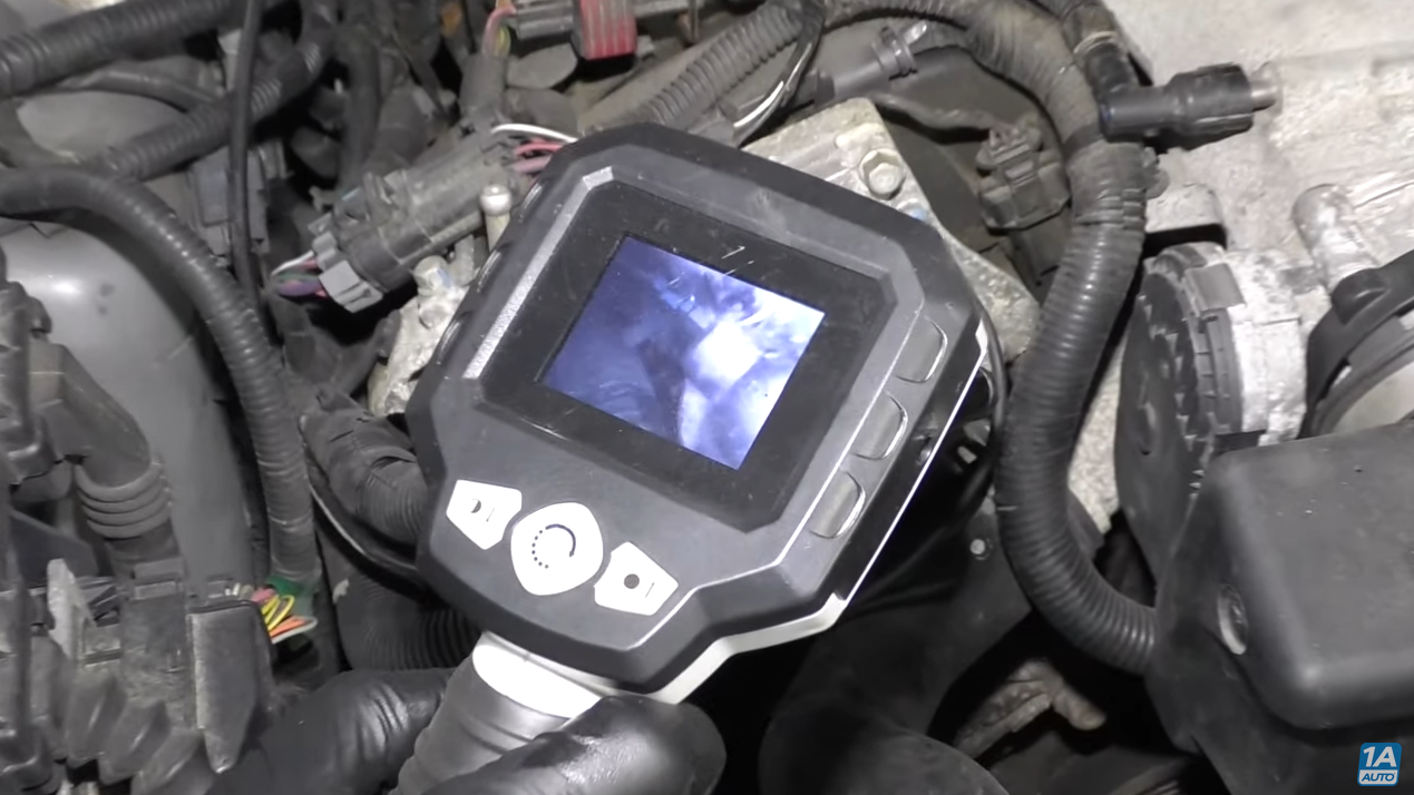 Monitoring a coolant thermostat with a borescope camera
