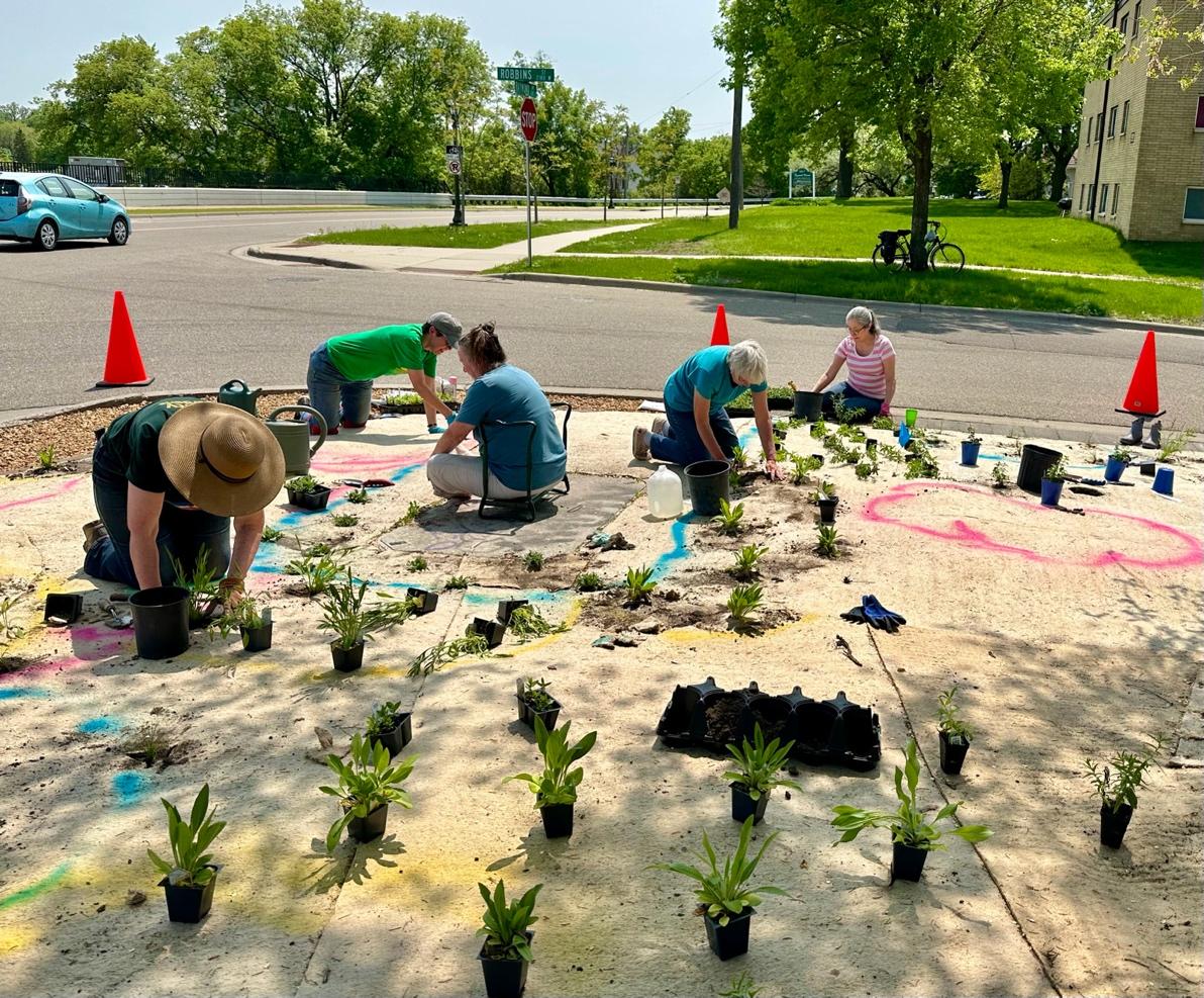 A group of people painting plants on the ground

Description automatically generated with low confidence