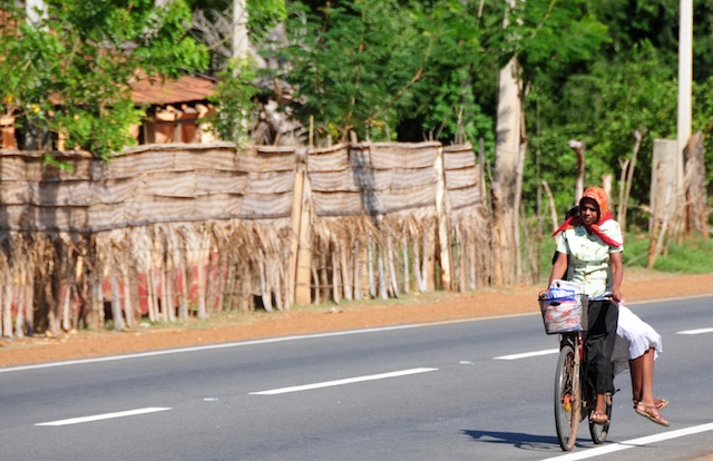 A woman covers her head with a cloth to escape the extreme heat in Sri Lanka's northern Jaffna District where daytime temperatures can reach 40 degrees Celsius. Credit: Amantha Perera/IPS