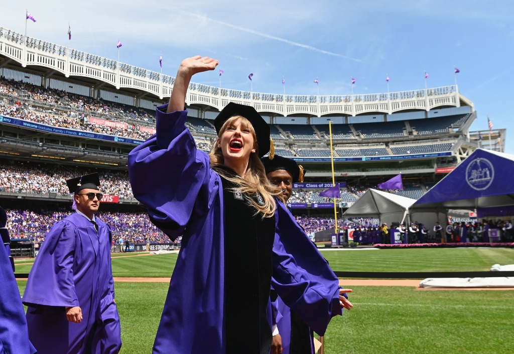 Taylor Swift waving to thousands of students