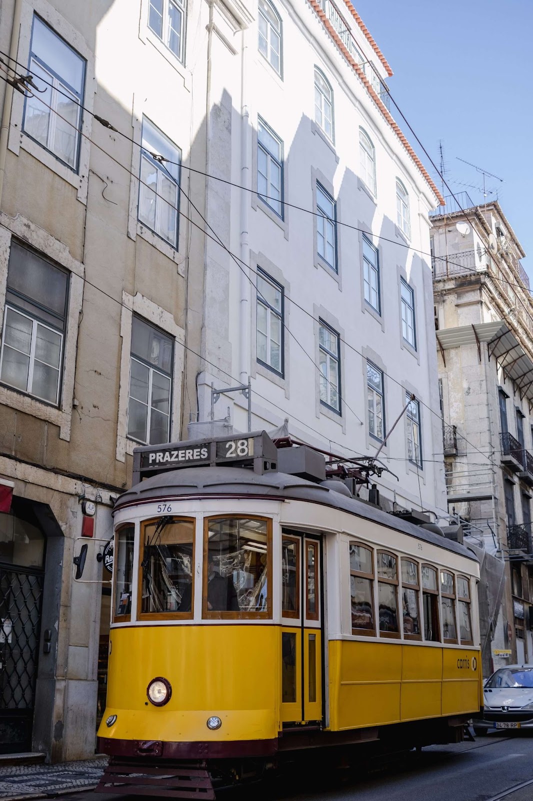 Tram 28, one of the oldest trams in Lisbon, yellow cab tram