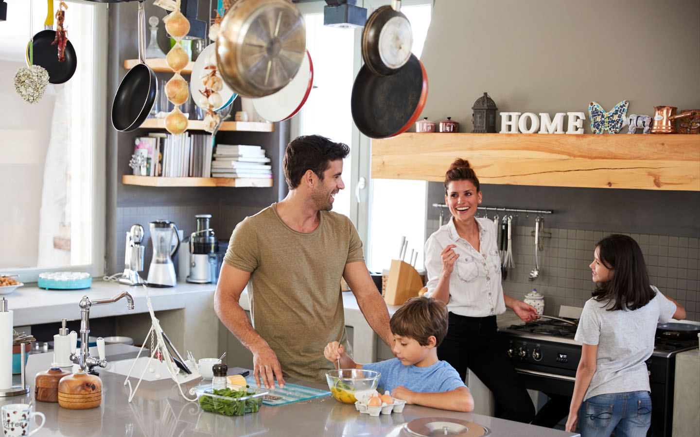 family enjoying in kitchen