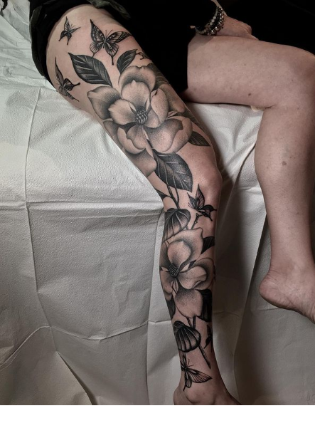 grey flower tattoo for leg
