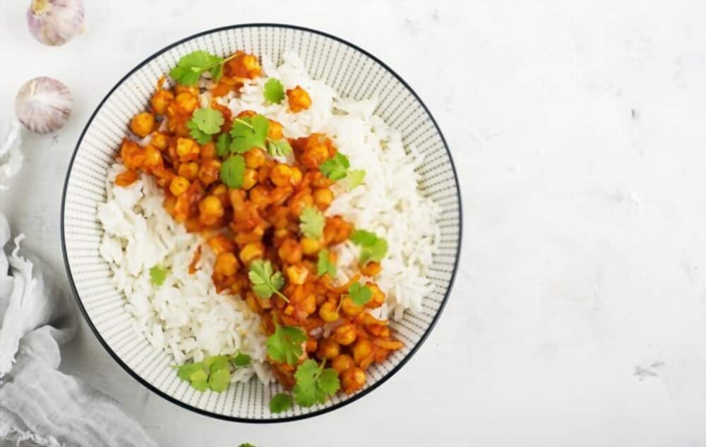 Cilantro topping on chickpea curry with basmati rice