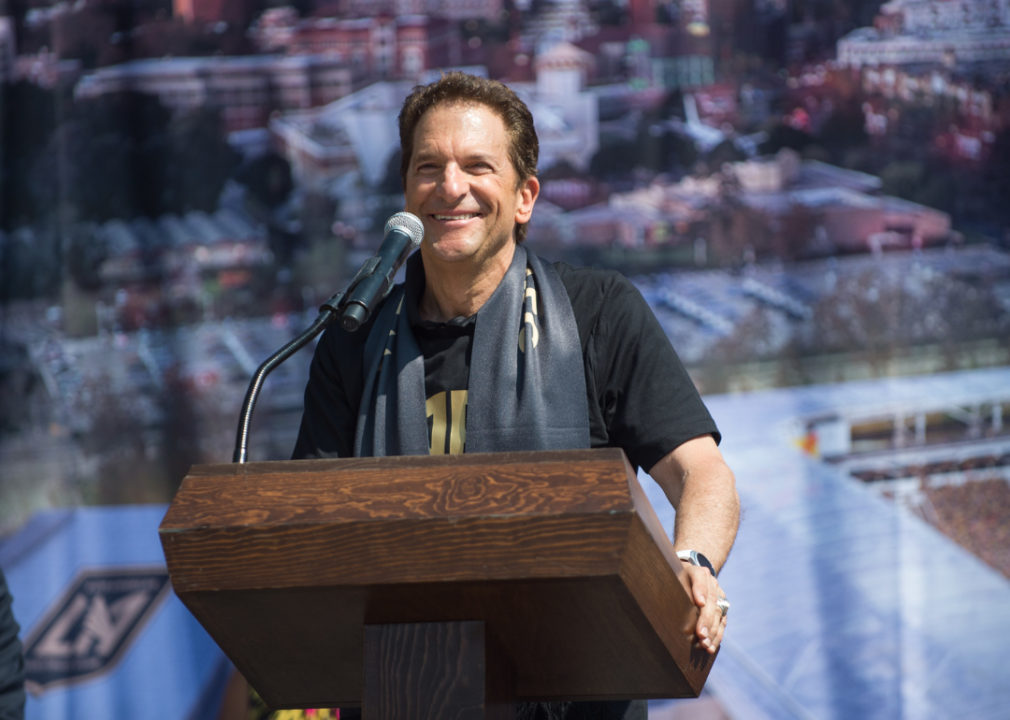 Peter Guber speaking onstage at the Los Angeles Football Club stadium groundbreaking ceremony