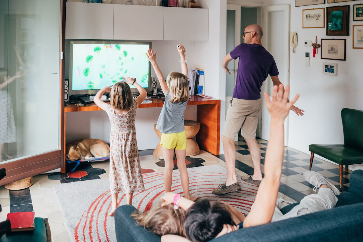 Mobile workforce management solutions: family playing Wii games at home