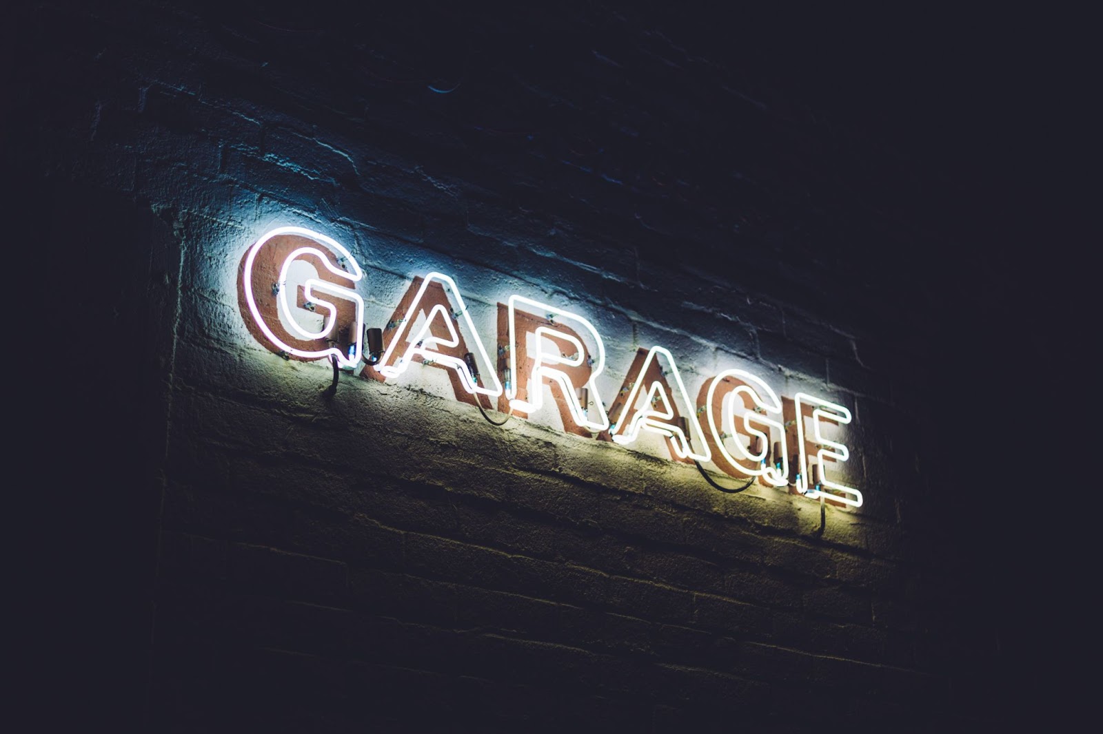 The words garage sticked on a wall with LED lights