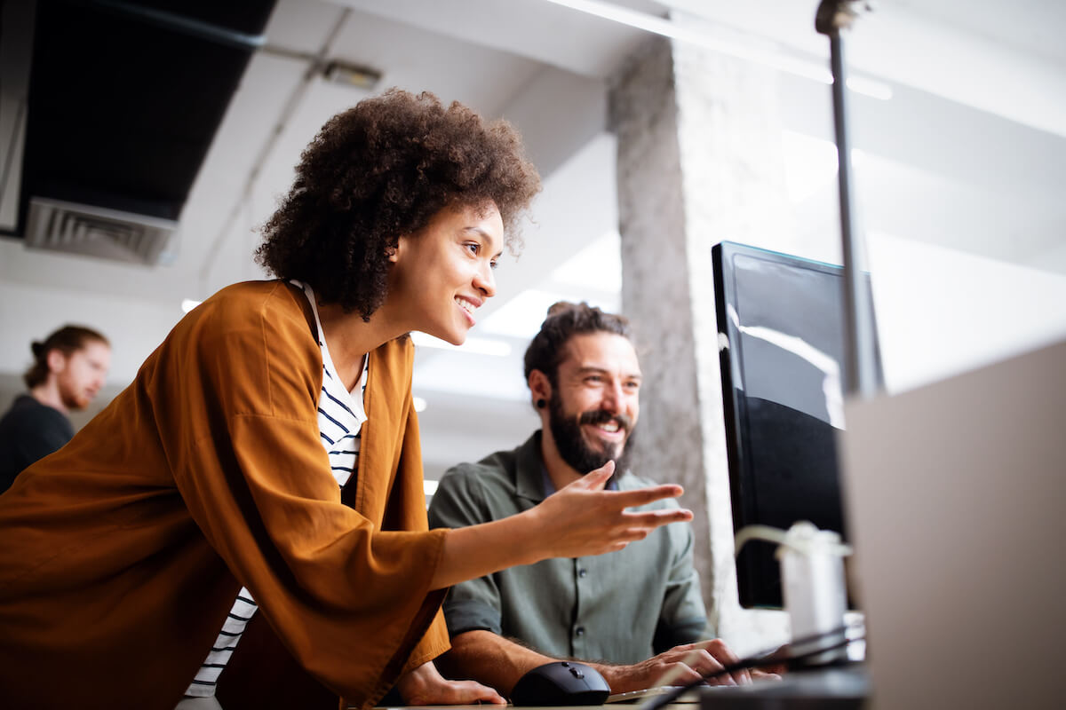 2 people happily working together