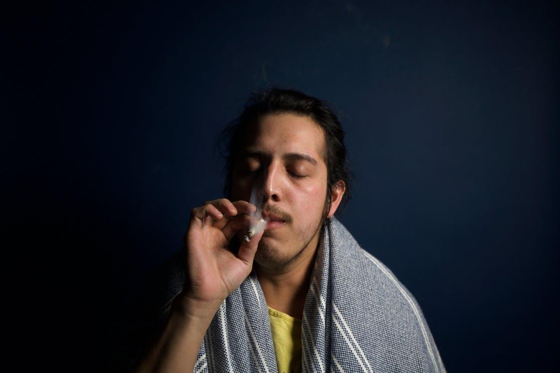 Free Man Smoking a Cigarette Stock Photo