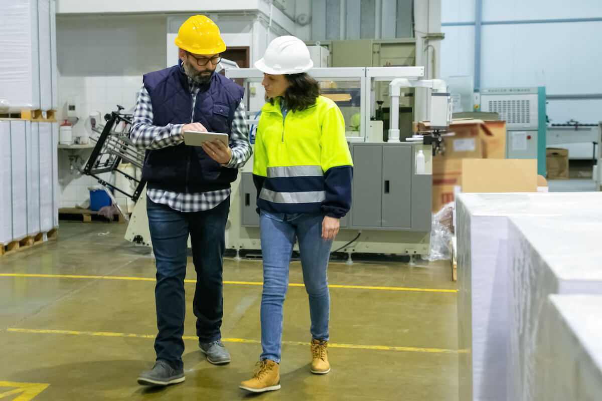 Engineers looking at a tablet