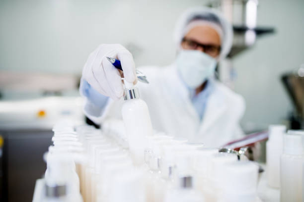 Healthcare industry. Creme production. Working in laboratory with special equipment. stock photo