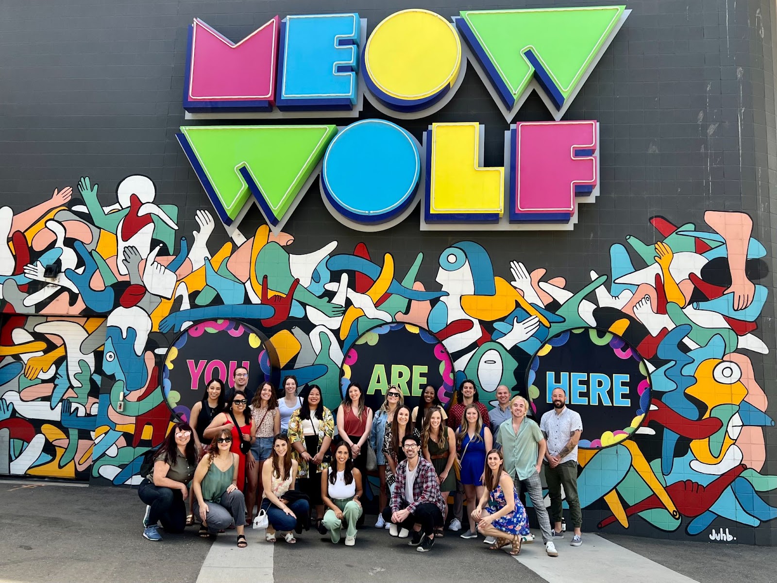 A group photo of the JDM Team at the Meow Wolf exhibit in Denver, Colorado.