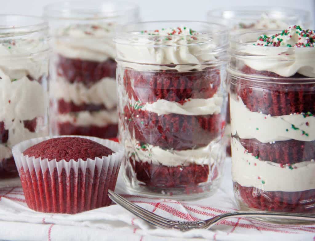 red velvet cake in a jar, fork and a red velvet cupcake