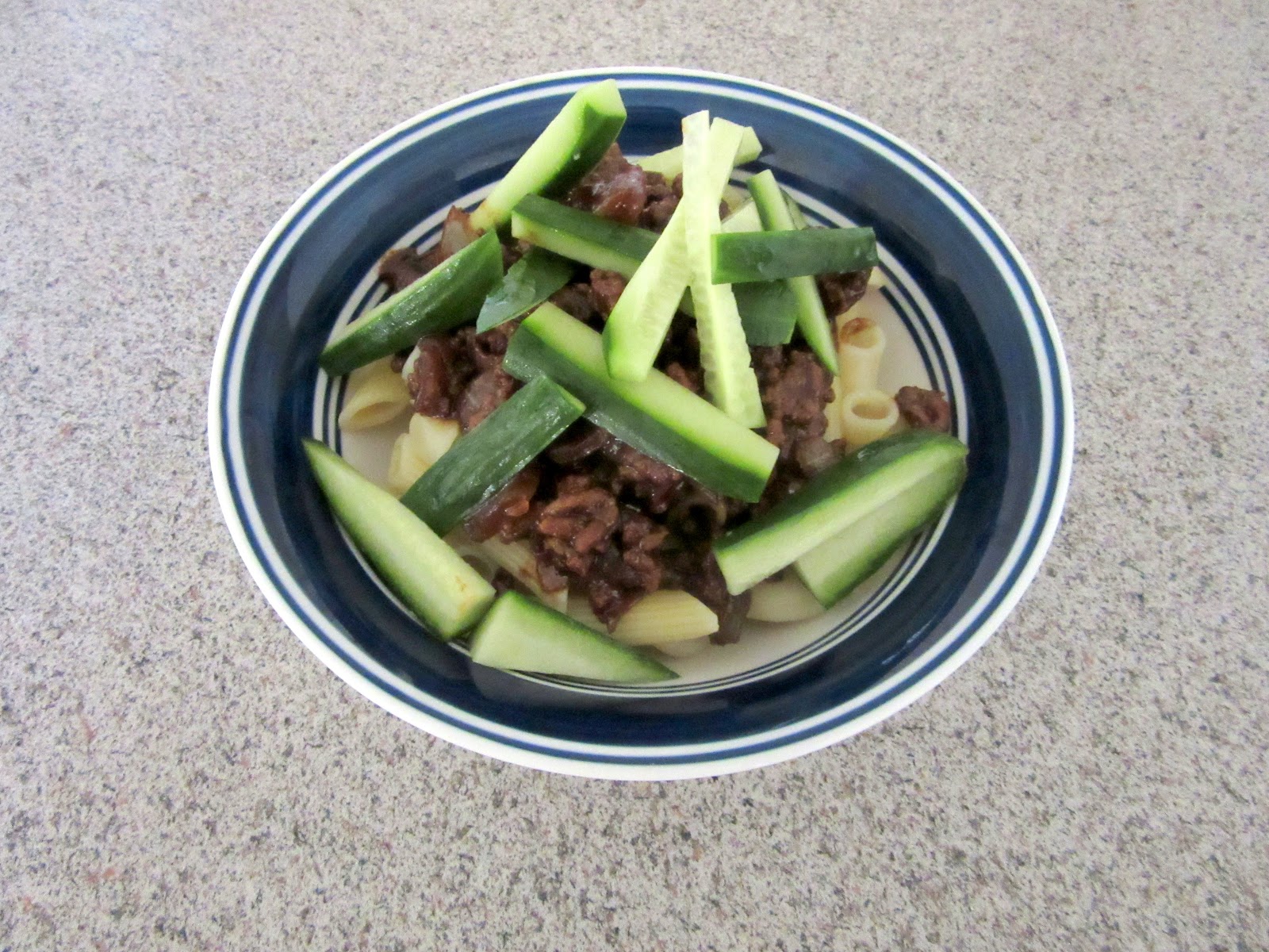 This version of zha jiang mian features pasta topped with a flavorful Chinese black bean sauce, ground beef and crunchy cucumber.