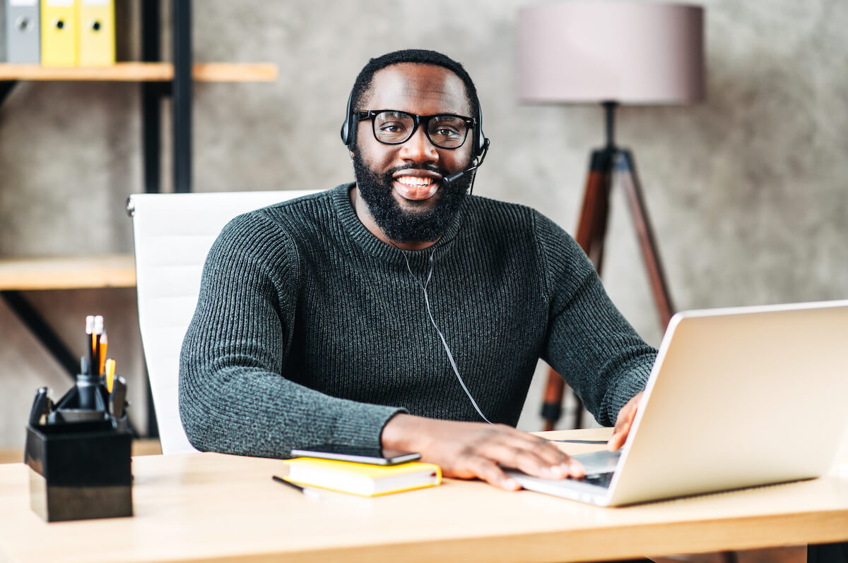 Clinical decision support: entrepreneur using headphones and a laptop