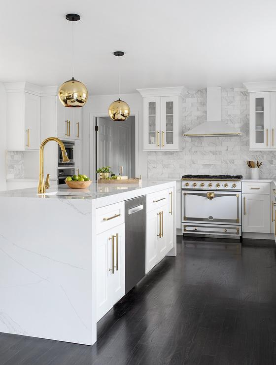 white shaker kitchen with brass globe lights