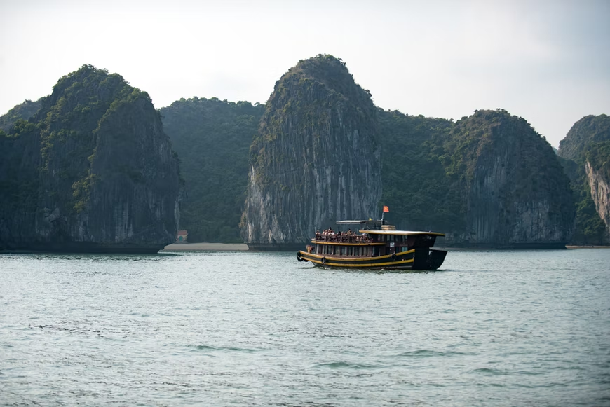 a small junk boat in Halong Bay
