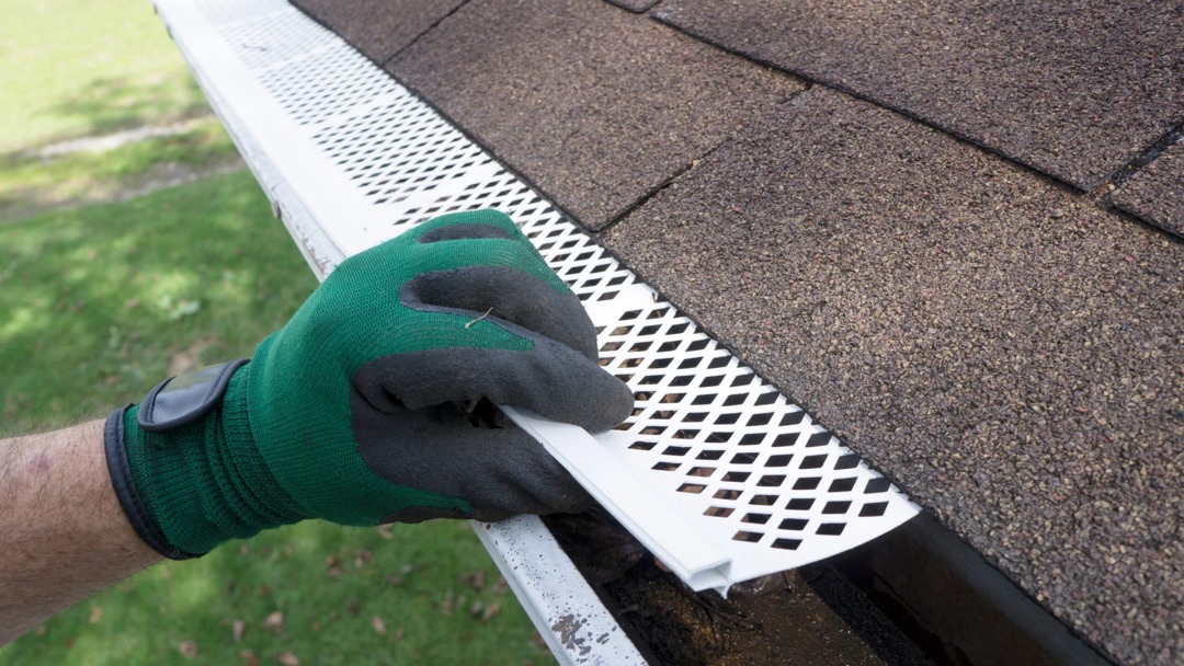surface tension gutter guard being installed