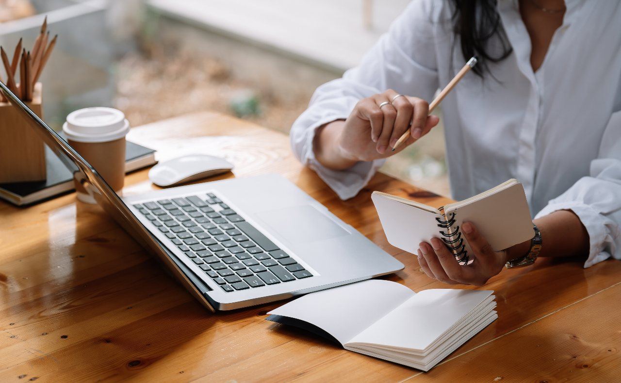 Woman with writing schedule notepad