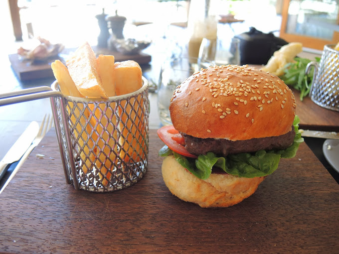 a burger and fries on a table